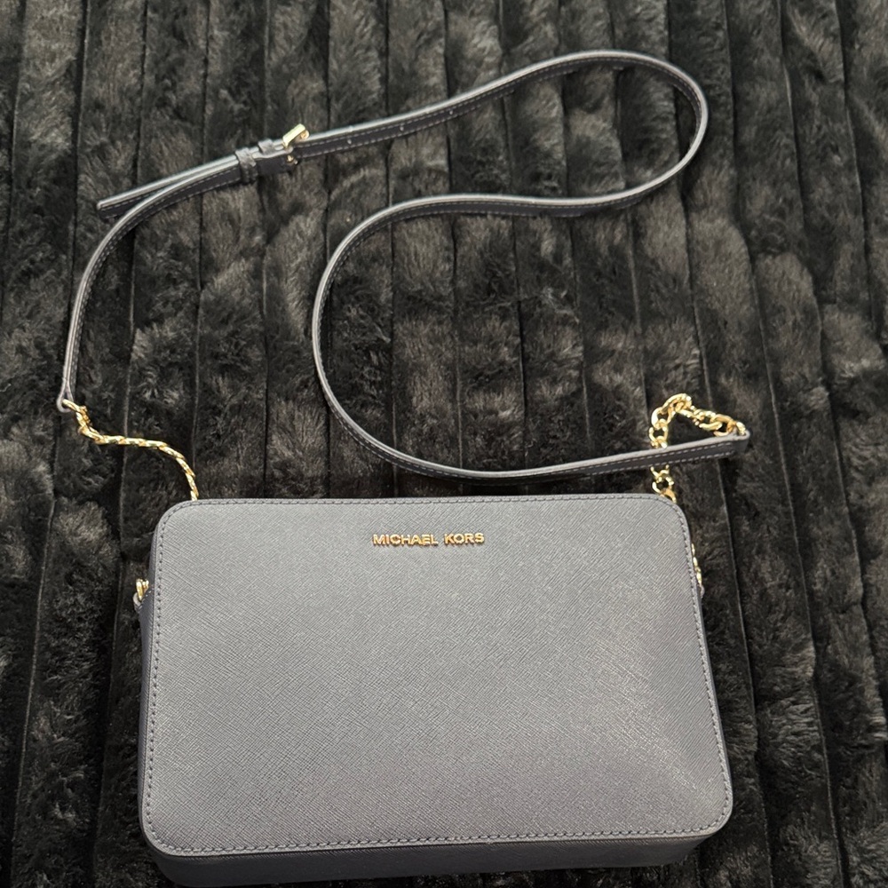 Michael Kors Elegant Blue Crossbody with Gold Details and Wallet.